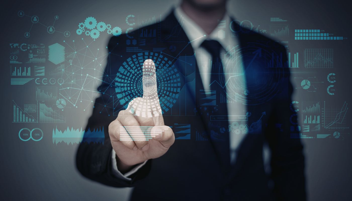 A business man is touching a digital screen with his finger.