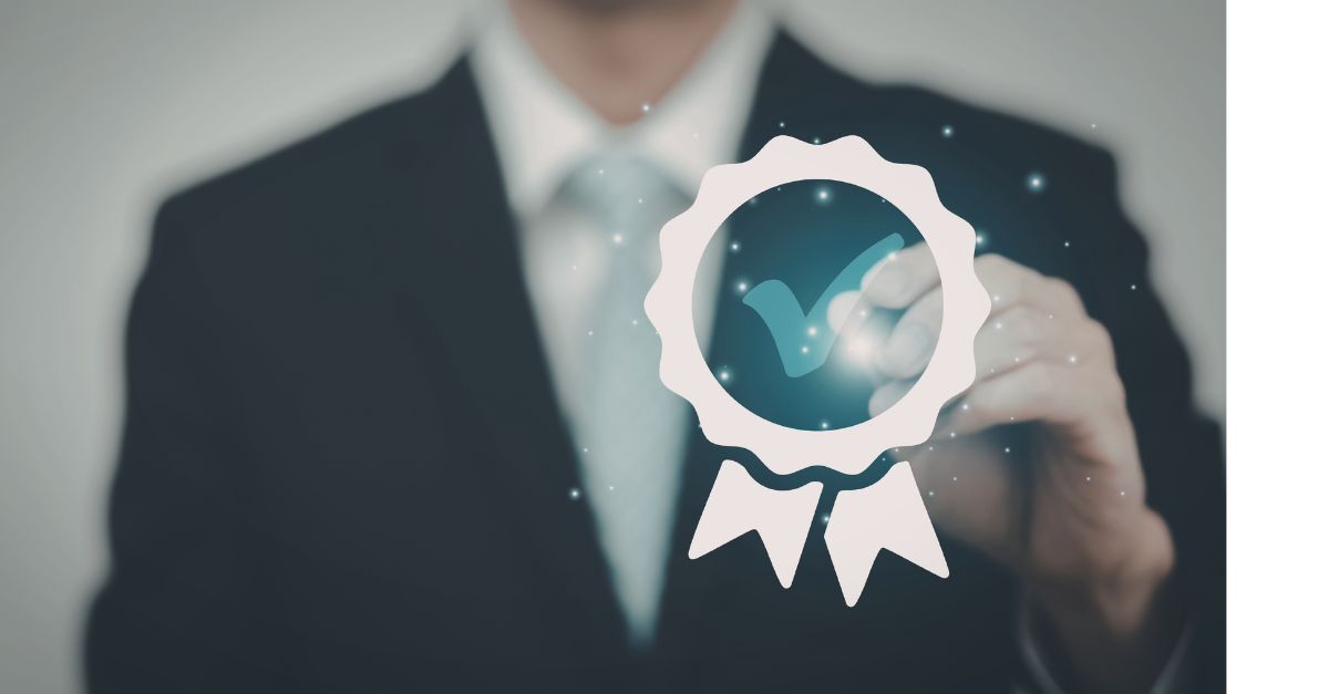 A business man has a badge with a tick in it showing a well done throught.