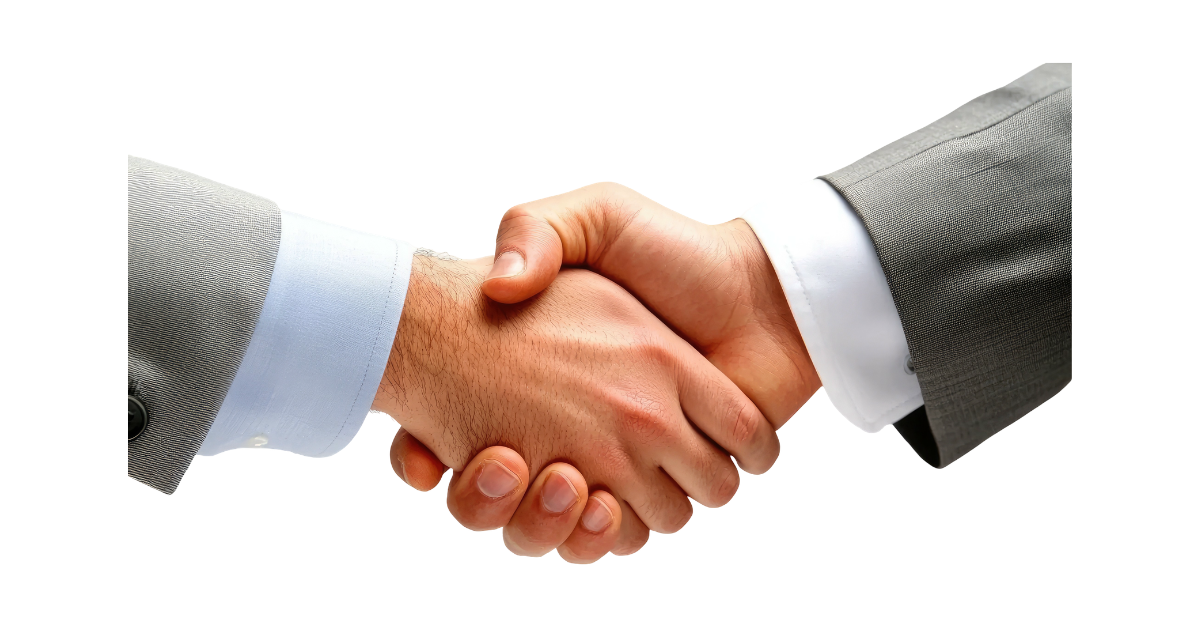 A close up of two men in suits hand shaking.