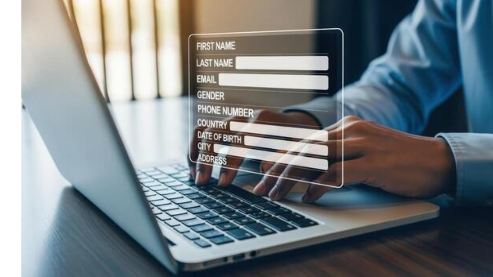A laptop open with empty boxes where you can fill in your personal details.