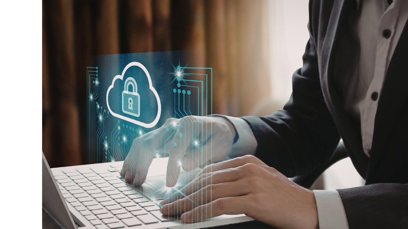 A business man is typing on the laptop and there is a padlock showing safety and data protection.