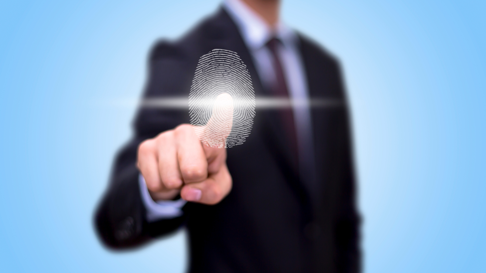 A business man has his finger pointing and a digital print is shown.