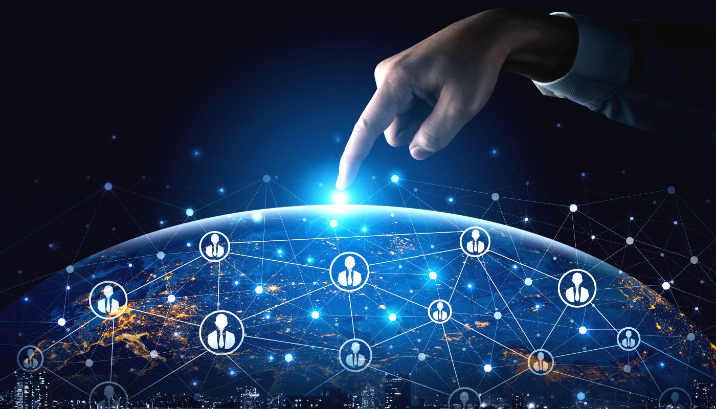 There is a digital version of the world and digital people with someone pointing at it.