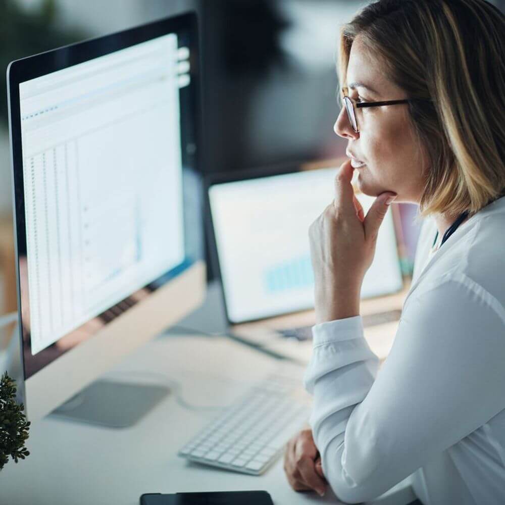 Women intensely looking at her computer.