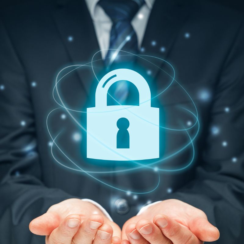 A business man with his hands open and a digital padlock above them.