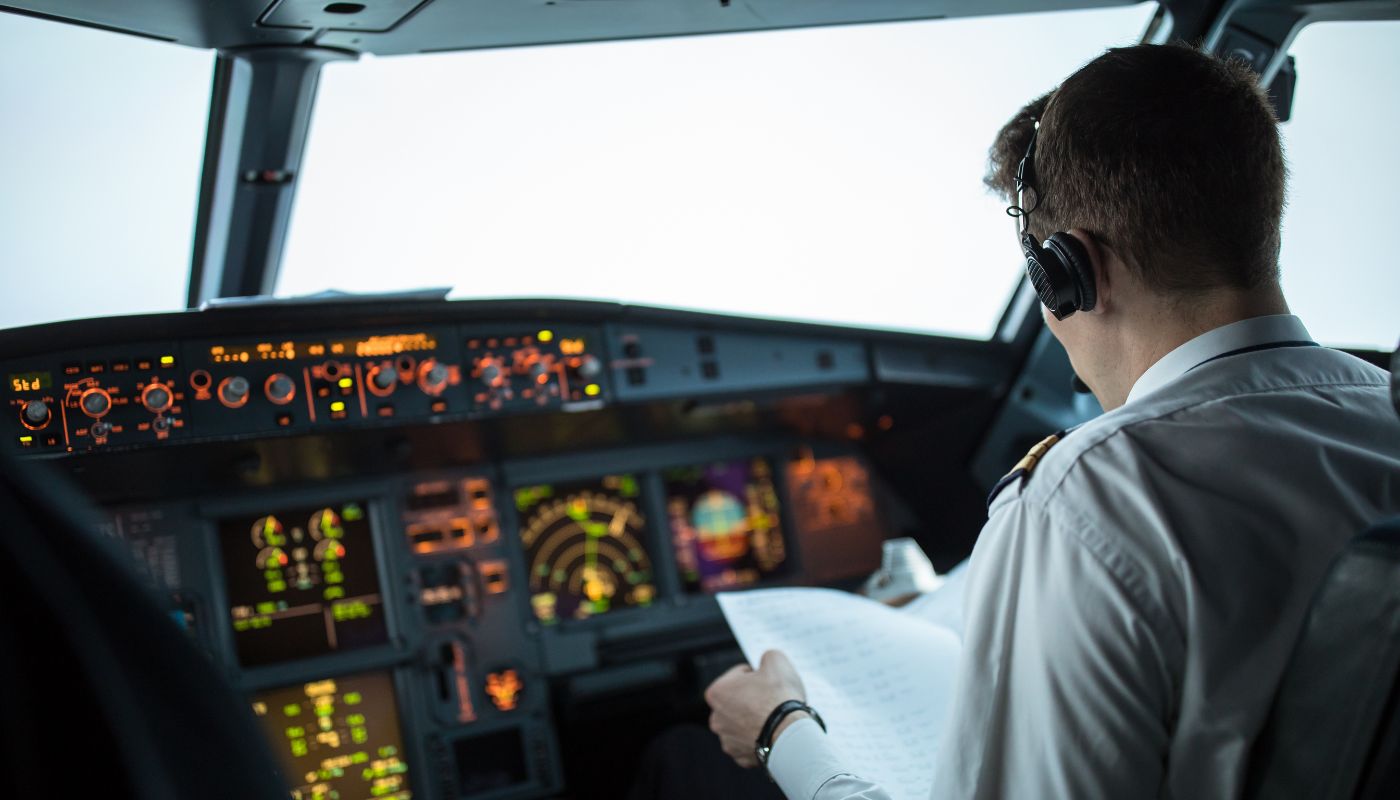 A pilot ready to take off the plane sat in his seat.