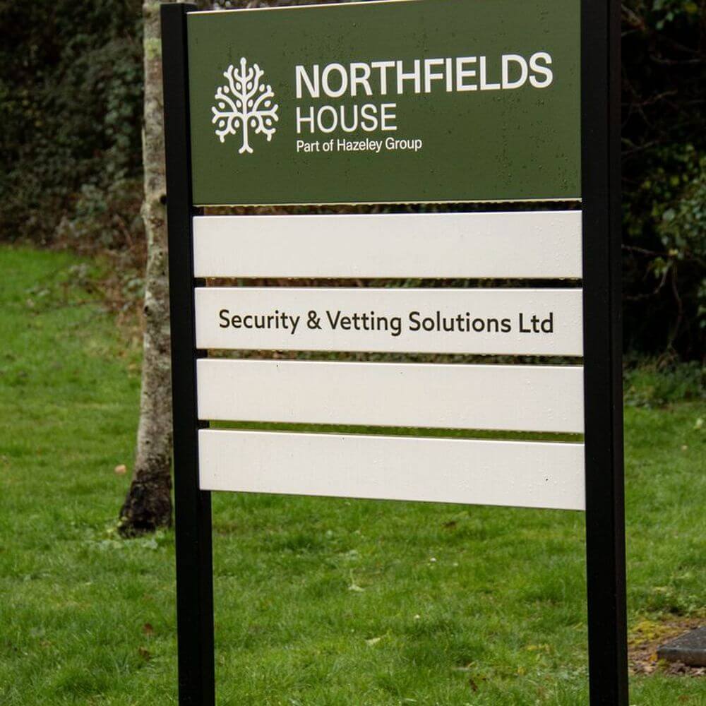 Security & Vetting Solutions sign outside the office building.